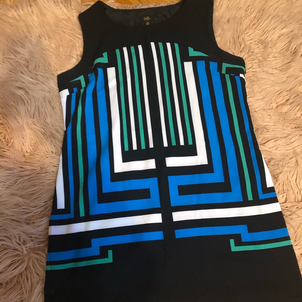 Black dress with white blue and green stripes